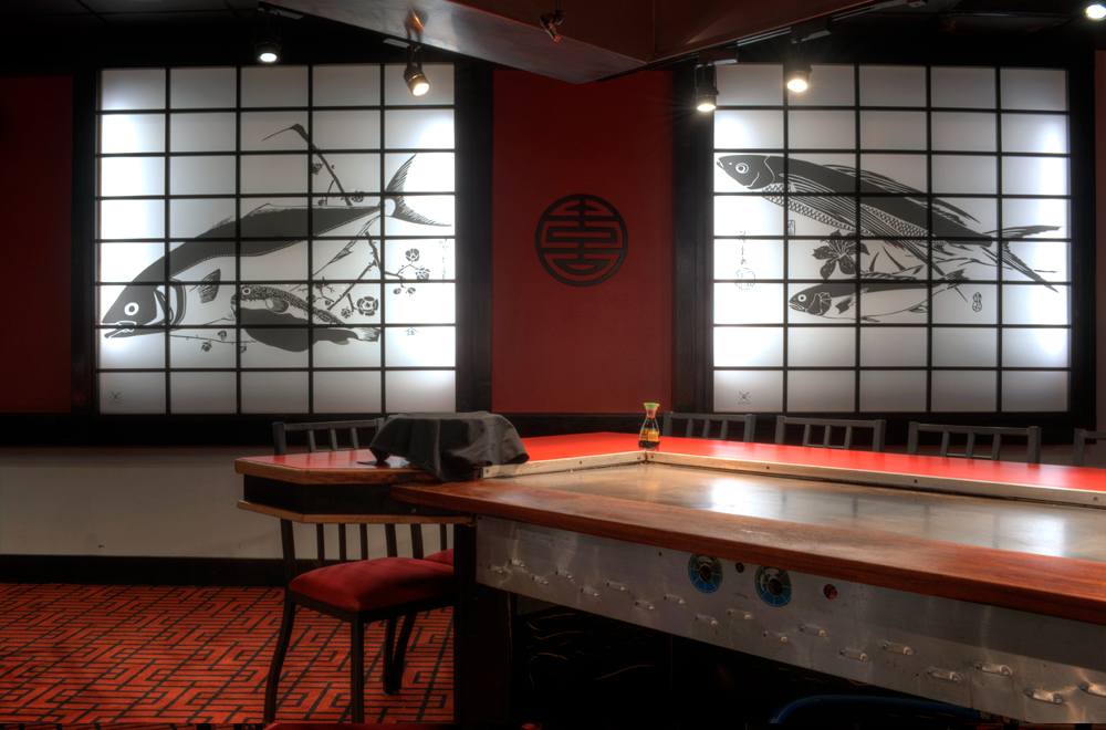 Inside Makoto Japanese Steakhouse with illustrated acrylic panels on wall 4